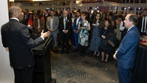 Rutgers University President William F. Tate IV, left, congratulates New Jersey General Assembly Speaker Craig Coughlin.