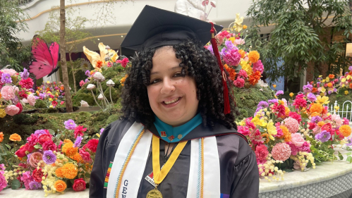 Cassandra Izquierdo, a Louis Eckstein Fellow, celebrates in May after earning her master’s degree at Rutgers-Newark.