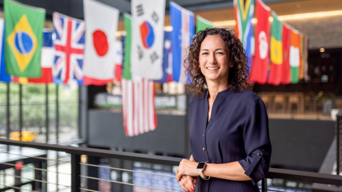 Lauren Nathan-LaRusso DC’03, GSE’04 enjoys the World Cup decorations at Gateway in Newark, where her World Cup Host Committee office is located. Photo by John O'Boyle