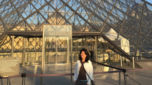 Rutgers alumna Samphoas Huy, who earned master’s and doctoral degrees at Rutgers–Newark, at the Louvre in Paris.