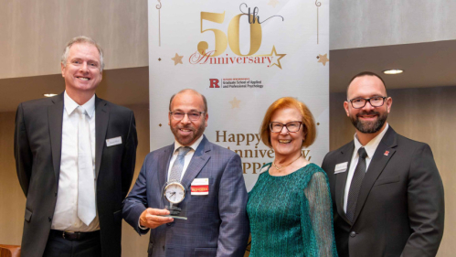 John Vaccaro (second from left) receives the Donor Honoree Award at the Rutgers Graduate School of Applied and Professional Psychology's 50th Anniversary Gala.