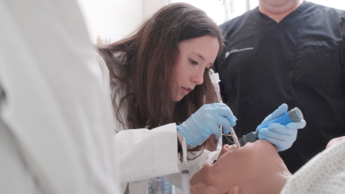 Rutgers Robert Wood Johnson Medical School student Miri Goodman, shown here in a simulation lab, is looking forward to the school joining with the Rutgers New Jersey Medical School in Newark to create the Rutgers School of Medicine in 2027.
