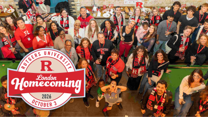 Photo of attendees at last year's Far from Homecoming event smiling at the camera