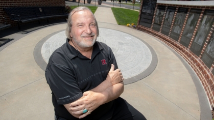 Jim Savage RC’71 in the Paul Robeson Plaza on the College Avenue Campus in 2023. Photo by Nick Romanenko.