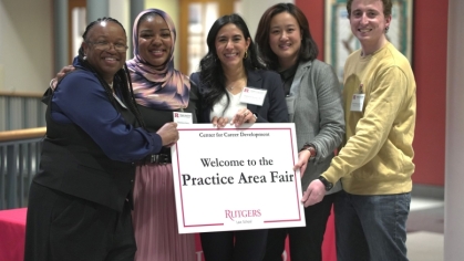 Jing Kong, second from right, volunteered to help law students for a Center for Career Development event.