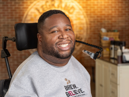Caption: Rutgers Hall of Distinguished Alumni inductee Eric LeGrand SAS’14 at his coffee shop in Woodbridge, New Jersey. Photo by John O’Boyle.