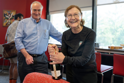 Eva Andrei during a celebration in the Department of Physics and Astronomy, alongside Chair John Hughes John Munson/Rutgers University