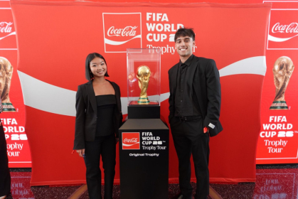 Jonathan Vasquez (right) attends the FIFA World Cup Trophy Tour at ASPIRE in the World Trade Center and stands with the FIFA World Cup Trophy. Courtesy of Jonathan Vasquez