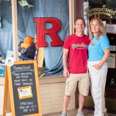 The Schnurs stand outside their shop on Easton Avenue.