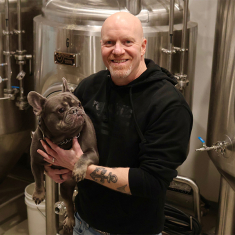 McLynn with his dog, Ragnar, at the Asbury Park Brewery
