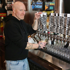 Bob McLynn behind the bar at the Asbury Park Brewery