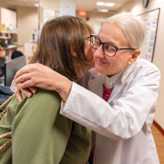Bachmann hugs longtime patient Adriana Bernstein following a consultation in New Brunswick. Photo by John O’Boyle.