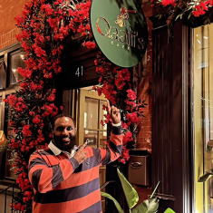 Omar Bareento in front of his café’s entrance in Newark.
