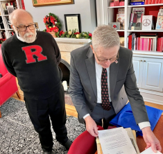 Longtime Rutgers faculty and staff member Cal Maradonna, left, and Rhodes in the Rutgers–Camden Alumni House