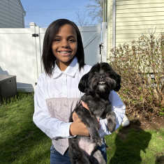 Jouni with dog Kobe in her backyard Photo by Allison Freeman.