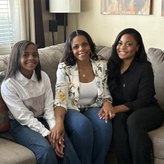 Nicole Simpson with daughters Journi, left, and Je-Naya, right. Nicole volunteers with the R Family Council. Photo by Allison Freeman.