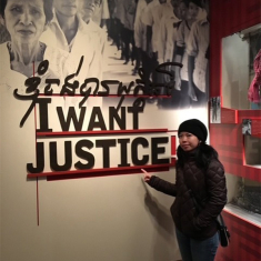 Huy in front of the sign for the Holocaust Museum exhibit she helped create.