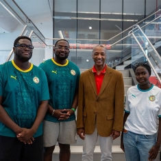 The Diop siblings greet President Tate at the welcome celebration for the team. (Photo by John Munson)
