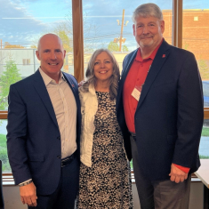 Flett, right, with Patti Solimene LC'91, secretary of the Veteran Alumni of Rutgers University (VARU), center, and Chip Clingham RC'91. They served together in ROTC while students at Rutgers–New Brunswick.